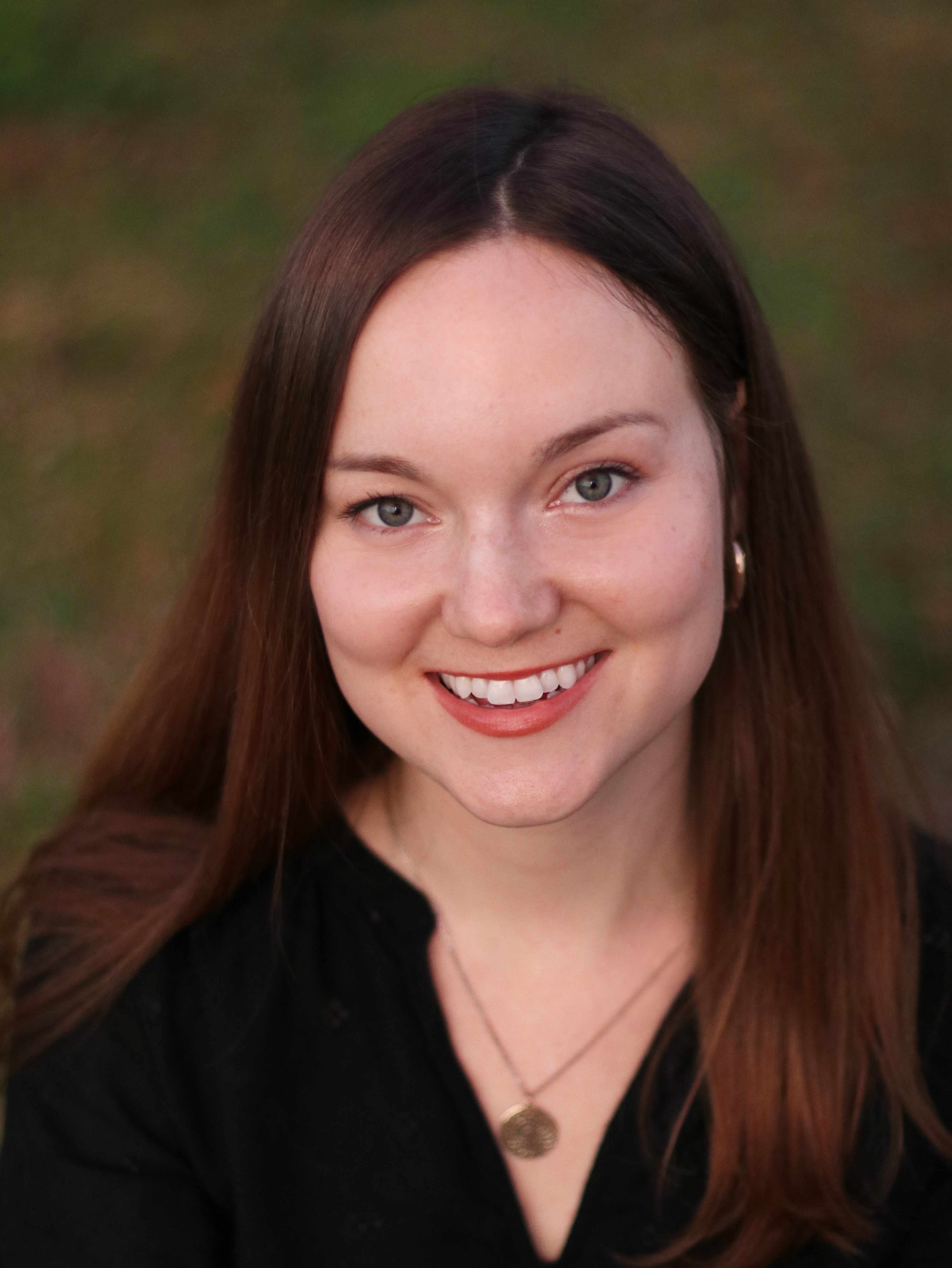 a profile picture of Katie Finn, a speaker at the conference.